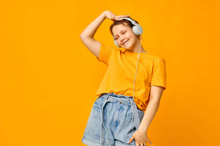 portrait of a young woman listening to music on headphones Youth style Lifestyle unaltered