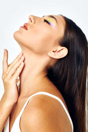 attractive girl long hair cosmetics posing light background unalteredの写真素材