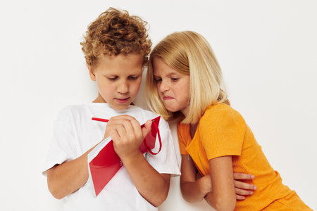 Small children draw in the notebook childhood entertainment color background unalteredの写真素材