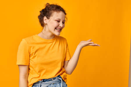 cheerful woman gestures with hands grimace emotions isolated backgrounds unalteredの写真素材