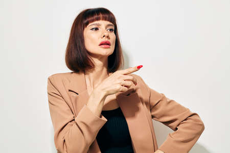 photo pretty woman in a beige jacket elegant style posing Lifestyle unalteredの写真素材