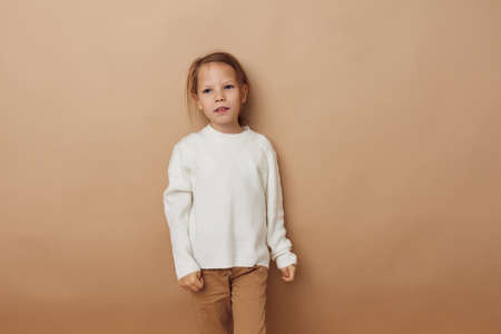 pretty young girl joy posing emotions fashion isolated backgroundの写真素材