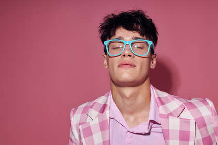 handsome guy fashionable glasses pink blazer posing studio model studio