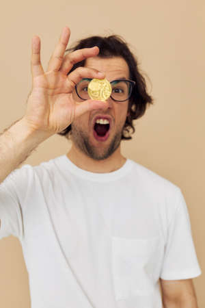 Cheerful man emotions cryptocurrency finance close-up isolated backgroundの写真素材