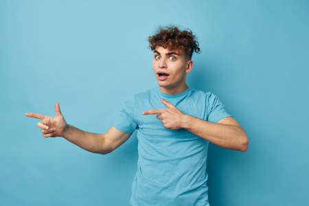 kinky guy in blue t-shirts with a pumped-up body isolated background