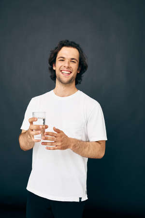 Attractive man transparent glass of water health isolated background