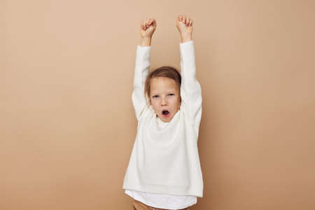 Portrait of happy smiling child girl childrens style emotions fun Lifestyle unaltered