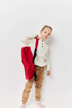 little girl red backpack stylish clothes Lifestyle unalteredの写真素材