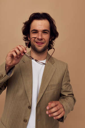 man in a suit posing emotions wear glasses isolated backgroundの写真素材