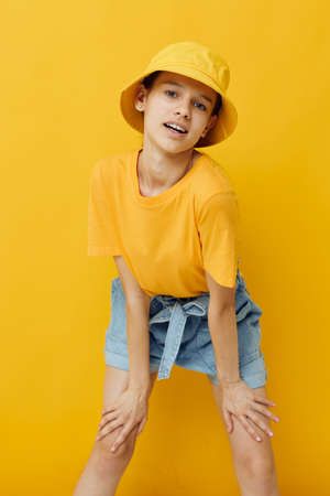 young woman in a yellow hat Youth style casual wear isolated backgroundの写真素材