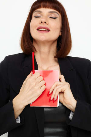 beautiful woman in a black jacket notepad writing ideas Lifestyle unaltered