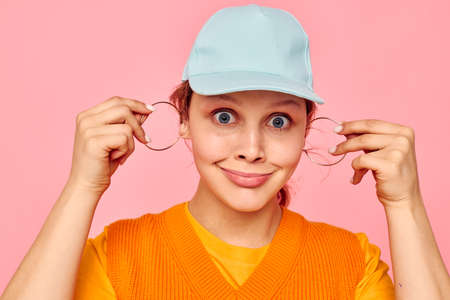 pretty woman in blue caps fashion posing emotions isolated backgrounds unaltered
