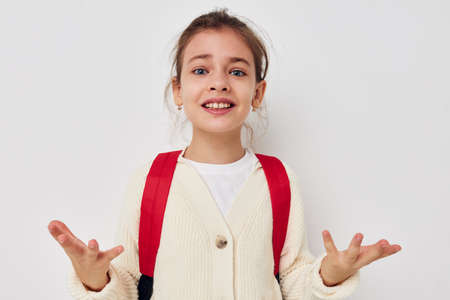 pretty young girl hand gesture red backpack childhood unaltered