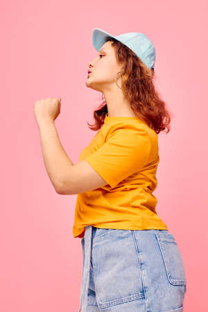 funny girl grimace posing summer style fashion pink background unalteredの写真素材