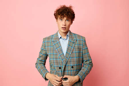 cute red-haired guy in a suit business look posing emotions Lifestyle unalteredの写真素材