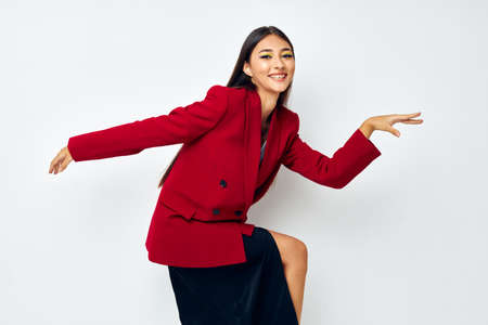 young woman fashion jacket posing isolated background unalteredの写真素材
