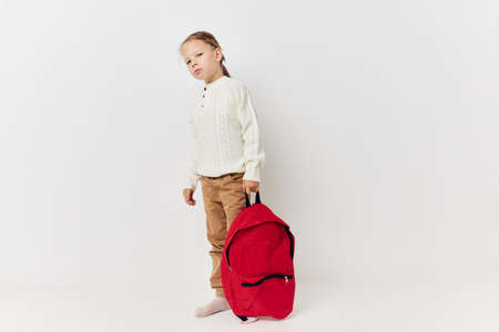 cute girl school backpack with a hat on his head Lifestyle unalteredの写真素材