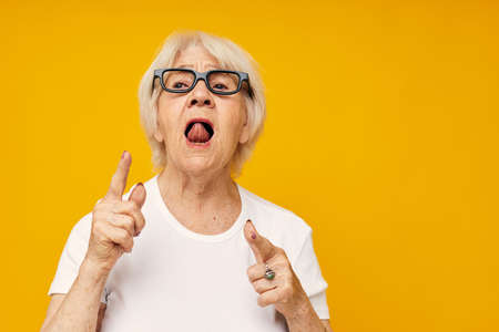 smiling elderly woman vision problems with glasses close-up emotionsの写真素材