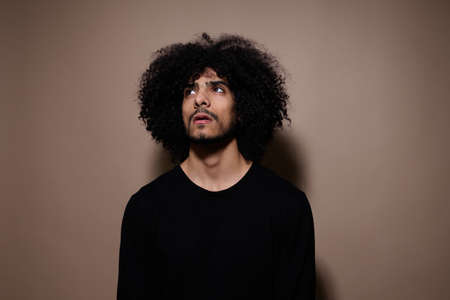man with curly hair posing fashion modern style Lifestyle unaltered