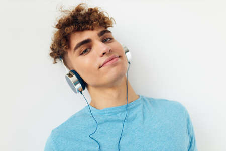 handsome guy music technology entertainment isolated backgroundの写真素材