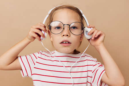 girl with headphones and glasses music entertainmentの写真素材