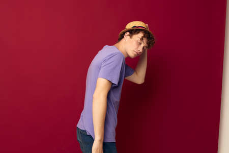 kinky guy red hair in casual wear Youth Style Studio red background unaltered
