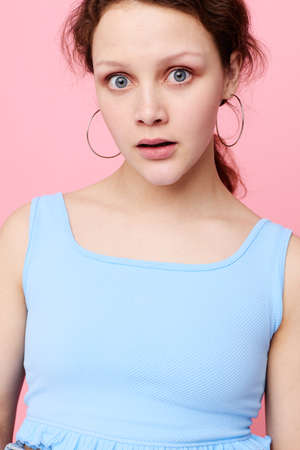 funny girl blue t shirt hand gestures emotion isolated backgrounds unaltered