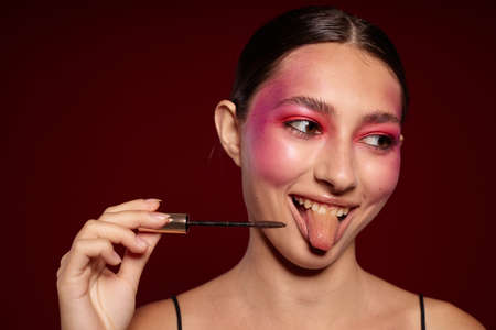 fashionable woman pink face makeup posing attractive look skin care cropped view unalteredの写真素材