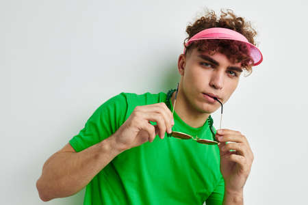 kinky guy green t-shirt decoration fashion glasses isolated backgroundの写真素材