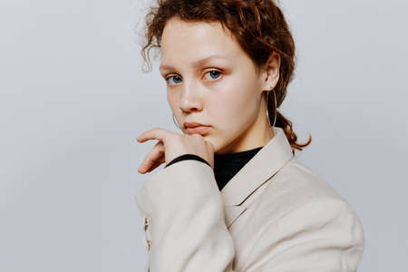 pretty woman In a light classic suit posing emotions Lifestyle unalteredの写真素材