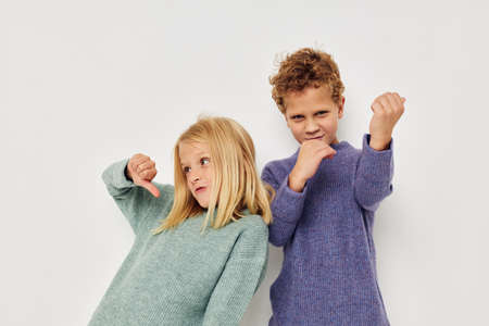 Little boy and girl hug entertainment posing friendship isolated background