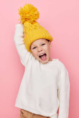 Portrait of happy smiling child girl fun in a yellow hat fun childhood unalteredの写真素材