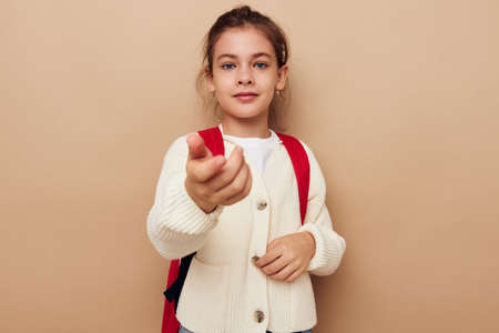 pretty young girl schoolgirl backpack school childhood unalteredの写真素材