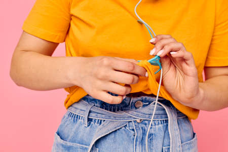 funny girl grimace headphones music entertainment technology pink background unaltered. High quality photoの写真素材