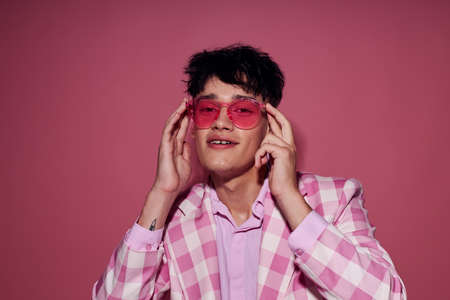 Photo of romantic young boyfriend self confidence pink plaid blazer fashion posing model studioの写真素材