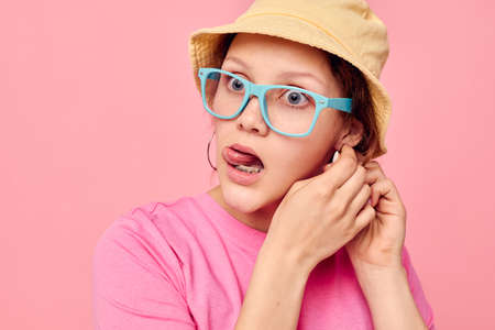 beautiful woman wearing a panama hat and glasses posing Studio Model unalteredの写真素材