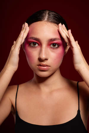 Sexy brunette woman posing bright makeup fashion charm isolated background unaltered