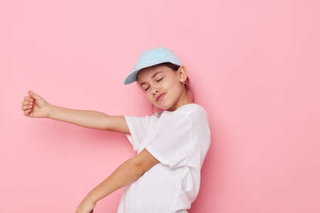pretty young girl posing white tshirt emotion isolated backgroundの写真素材