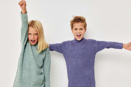 Portrait of cute children hug entertainment posing friendship Lifestyle unalteredの写真素材