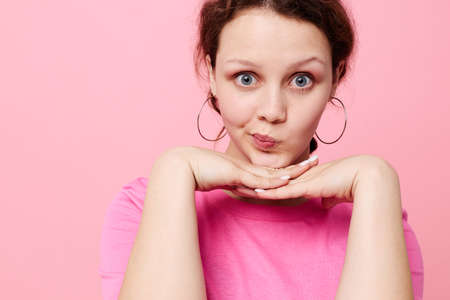 Stylish teenager girl model fashion pink t-shirt decoration posing isolated background unalteredの写真素材
