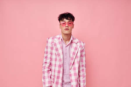 pretty man in stylish clothes jacket fashion gestures with hands self-confidence model studioの写真素材