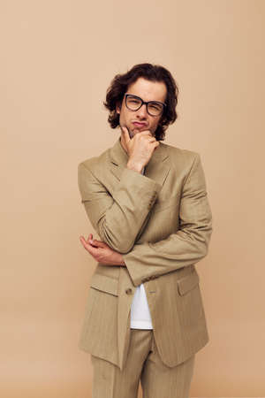 man in a suit posing emotions wear glasses Lifestyle unalteredの写真素材