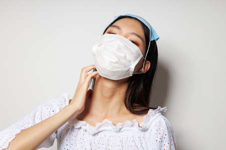 Portrait Asian beautiful young woman face shield safety close-up Lifestyle unalteredの写真素材