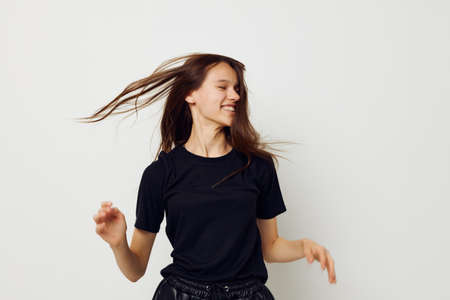 young woman in a black t-shirt hand gesture fun Lifestyle unalteredの写真素材