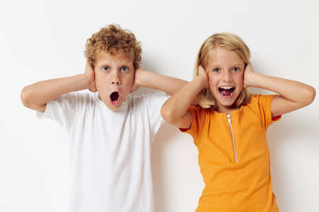 Cute preschool kids posing hand gesture smile casual wear isolated background unaltered