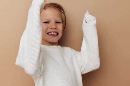 pretty young girl childrens style emotions fun isolated backgroundの写真素材
