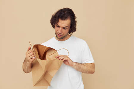 handsome man paper bag emotions posing Lifestyle unaltered