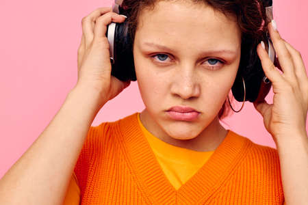 funny girl headphones music fashion posing Lifestyle unalteredの写真素材