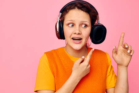 pretty girl grimace headphones entertainment emotions music isolated backgrounds unaltered