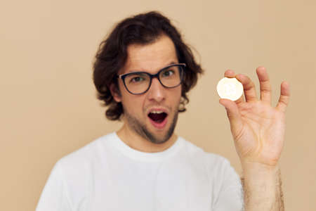 man in a white T-shirt with Bitcoin cryptocurrency isolated background